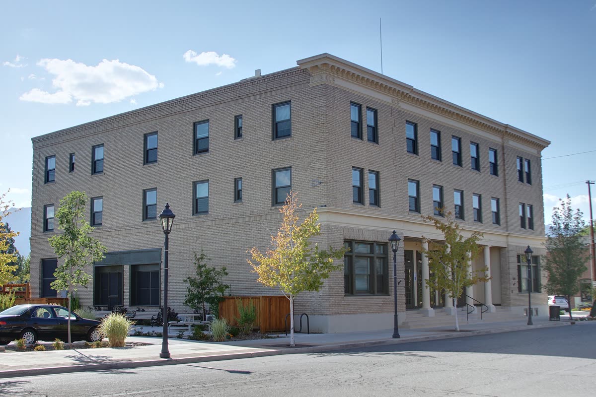 The three-story Minden Inn building on a street corner in downtown Minden