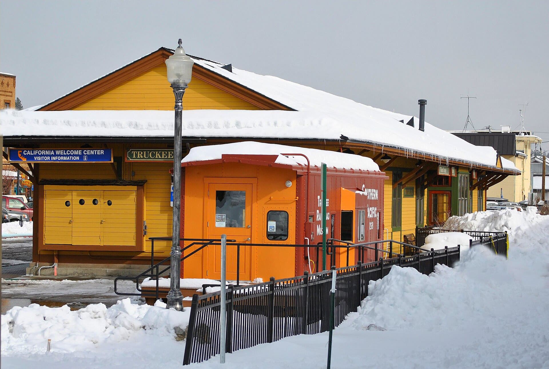 The historic Truckee train depot in winter, with snow on the roof