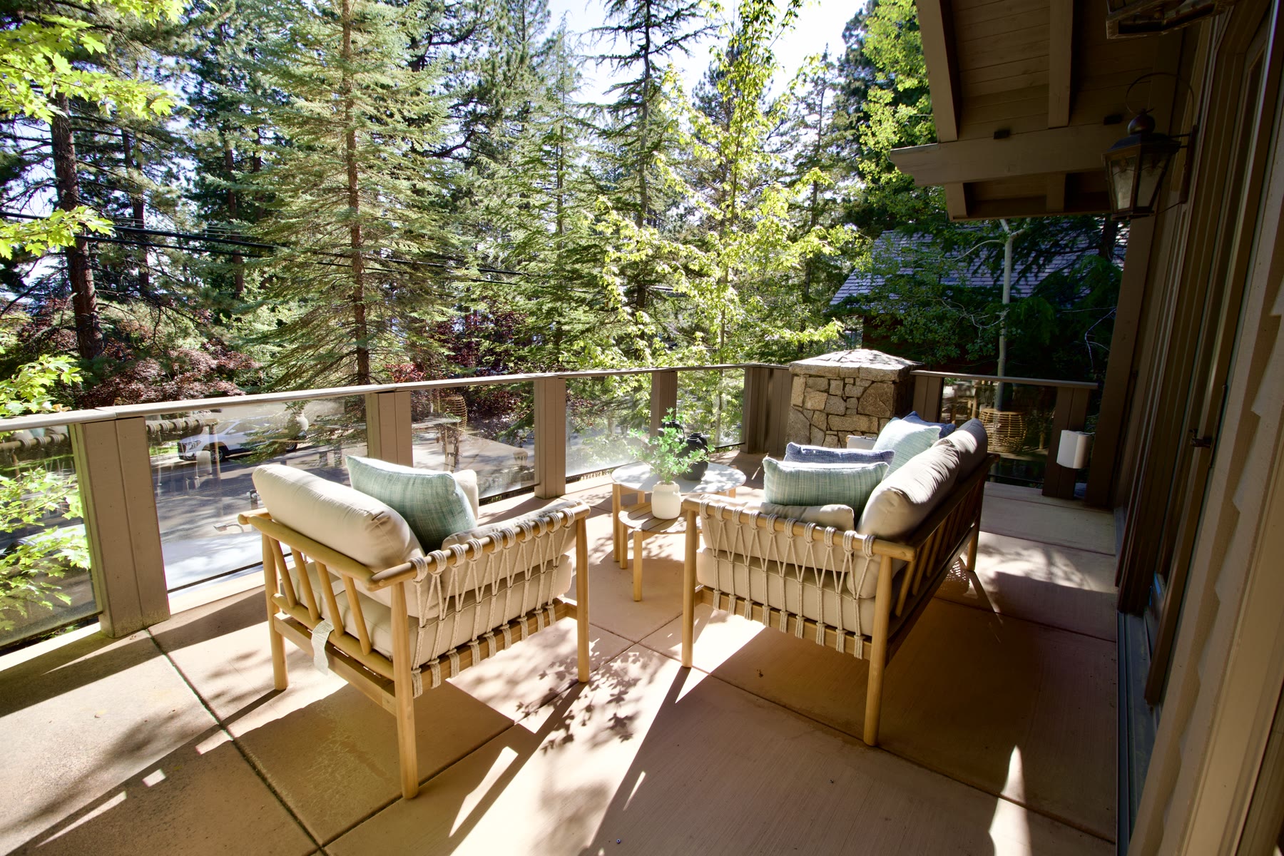 Staged deck with outdoor seating among the pines